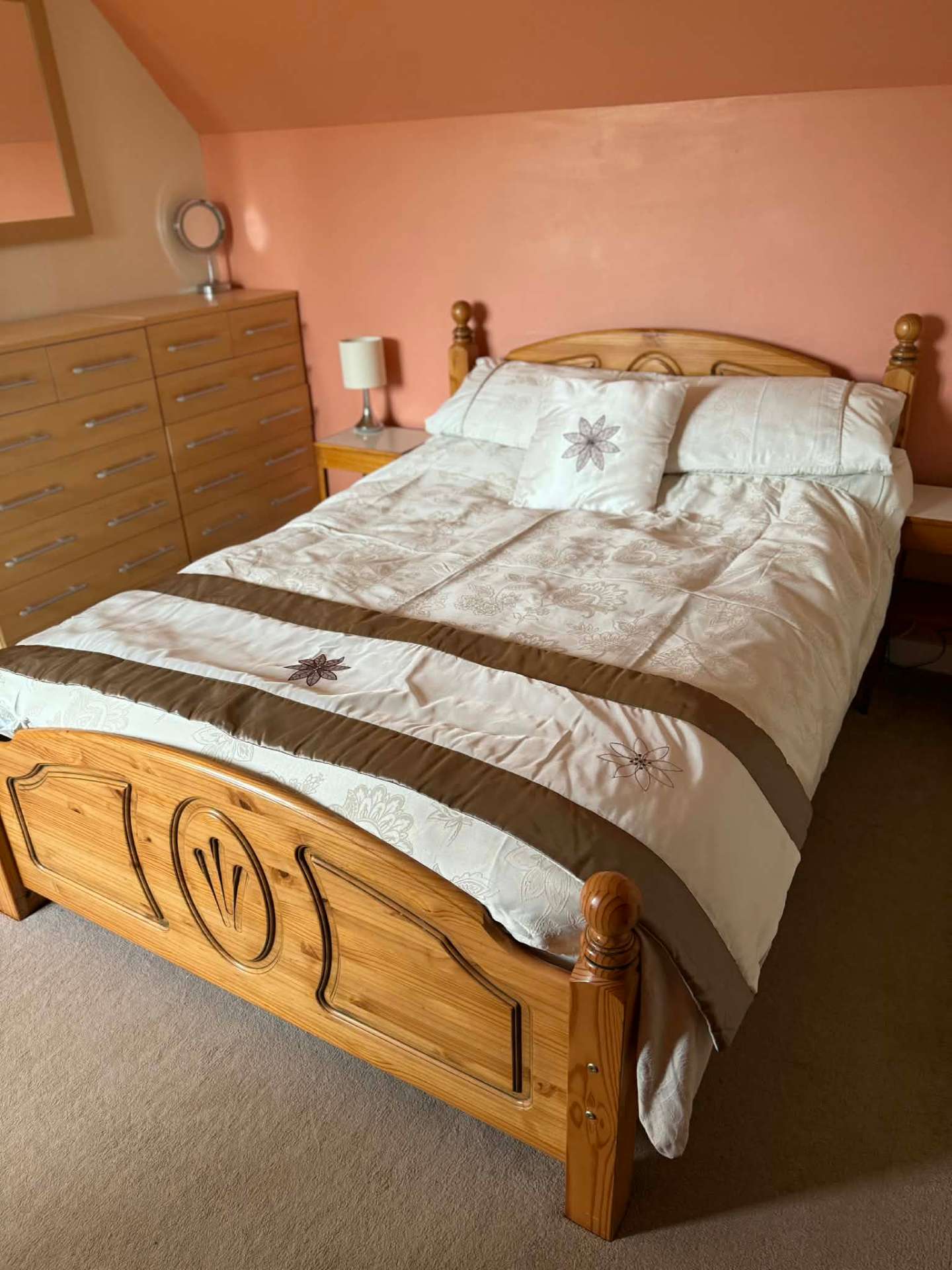 Double bedroom with pine bed frame