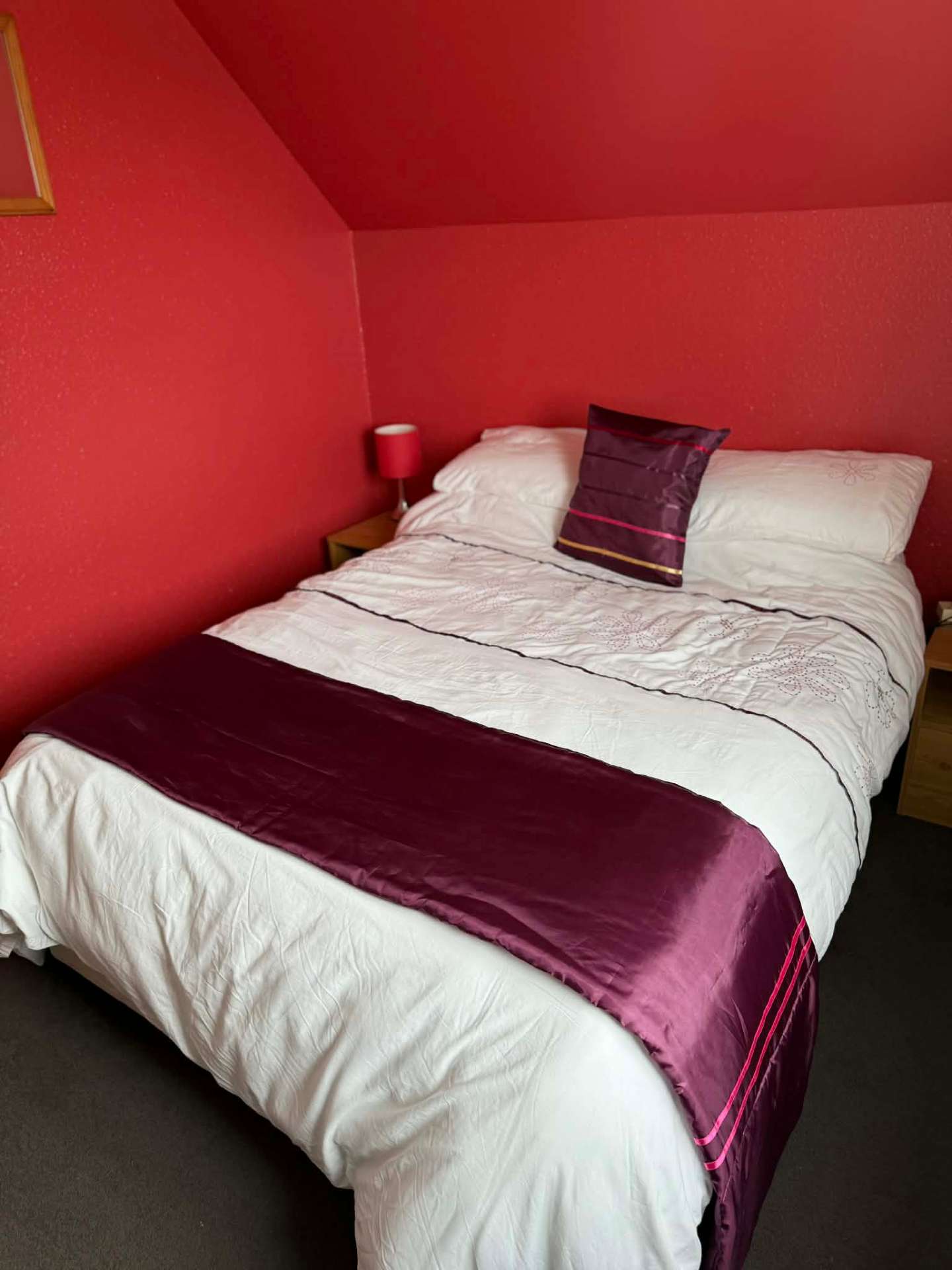 Double bedroom with warm red walls