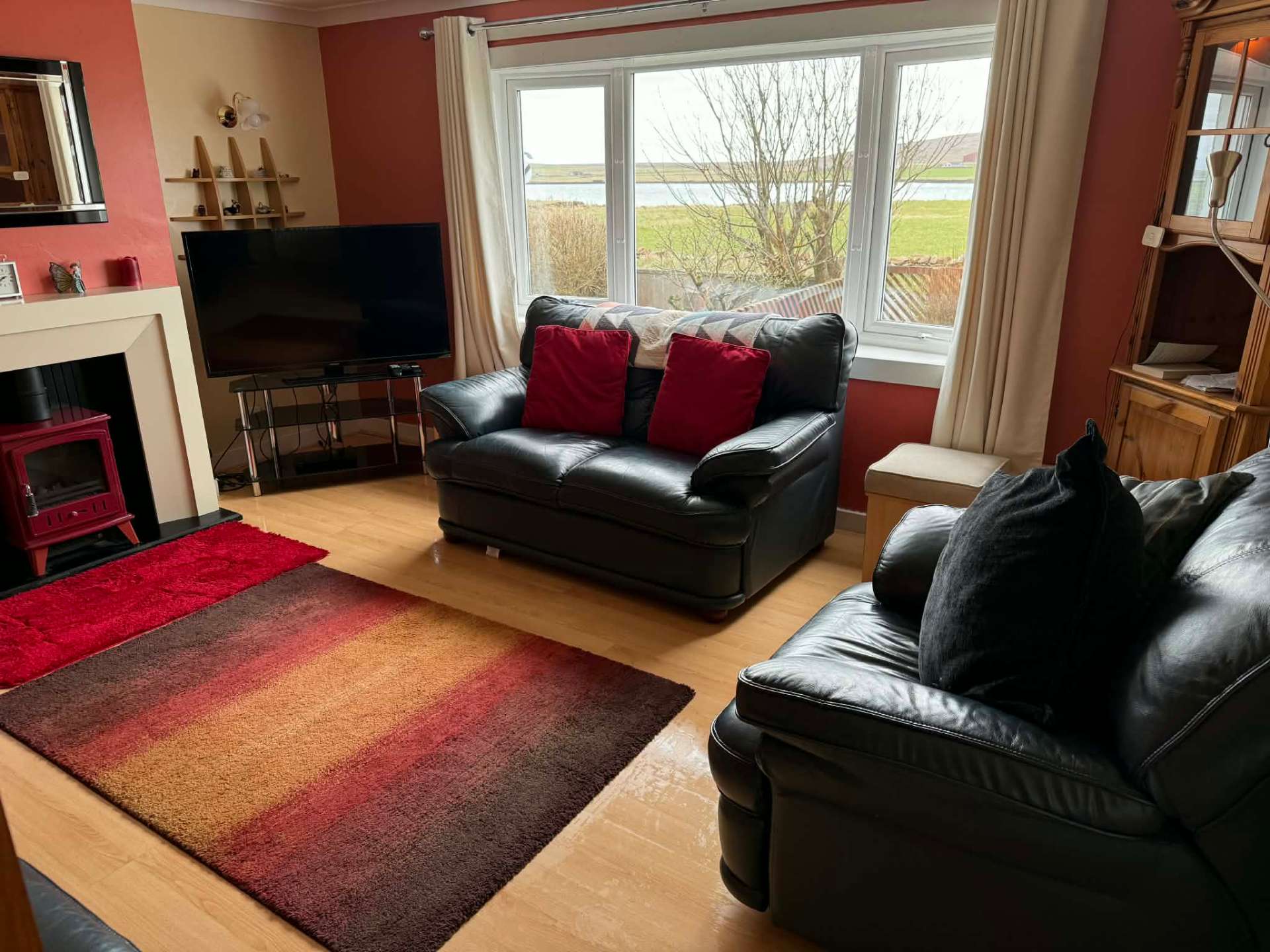 Living room with sea views across Baltasound