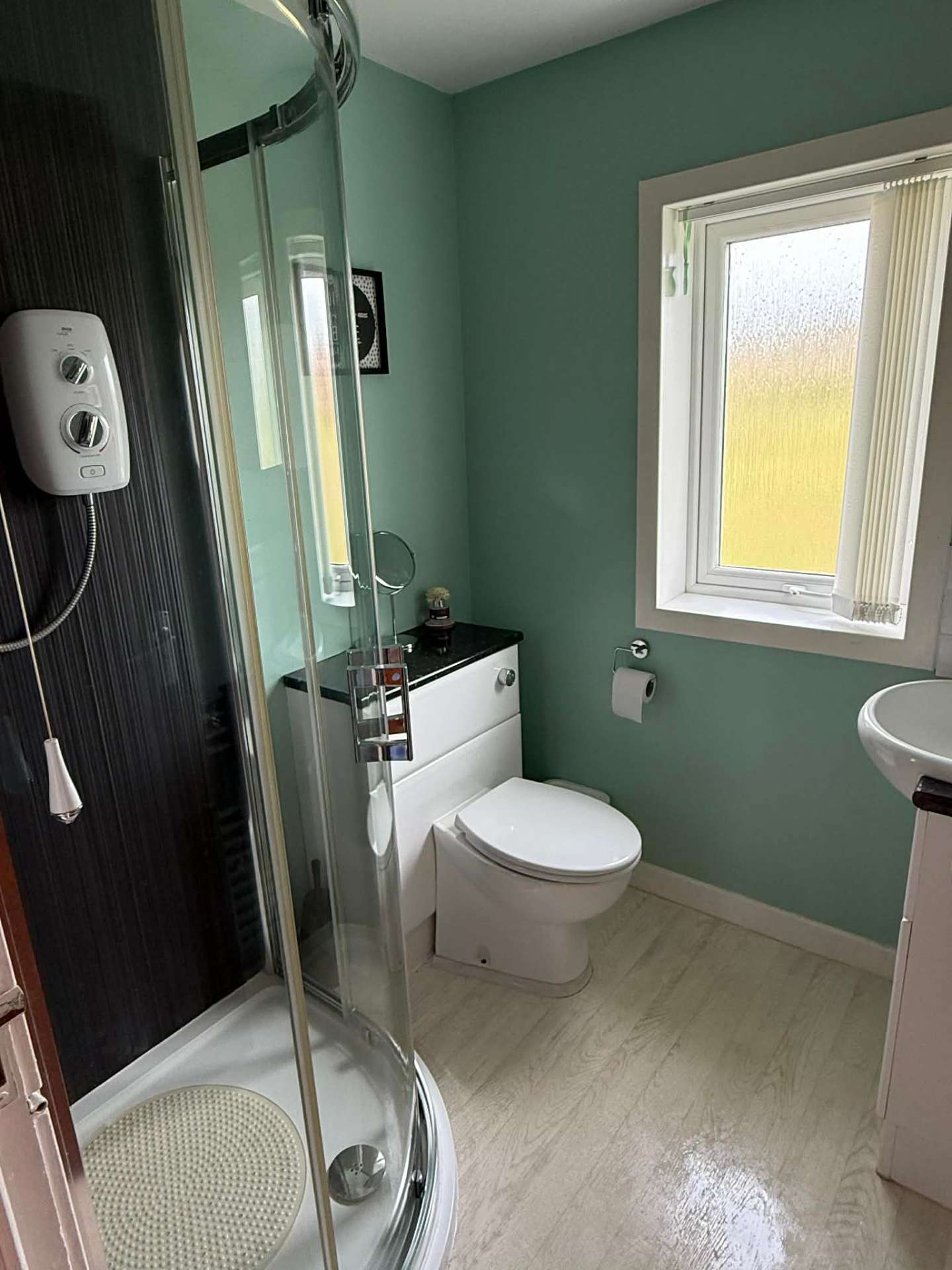 Second bathroom with shower, WC and basin