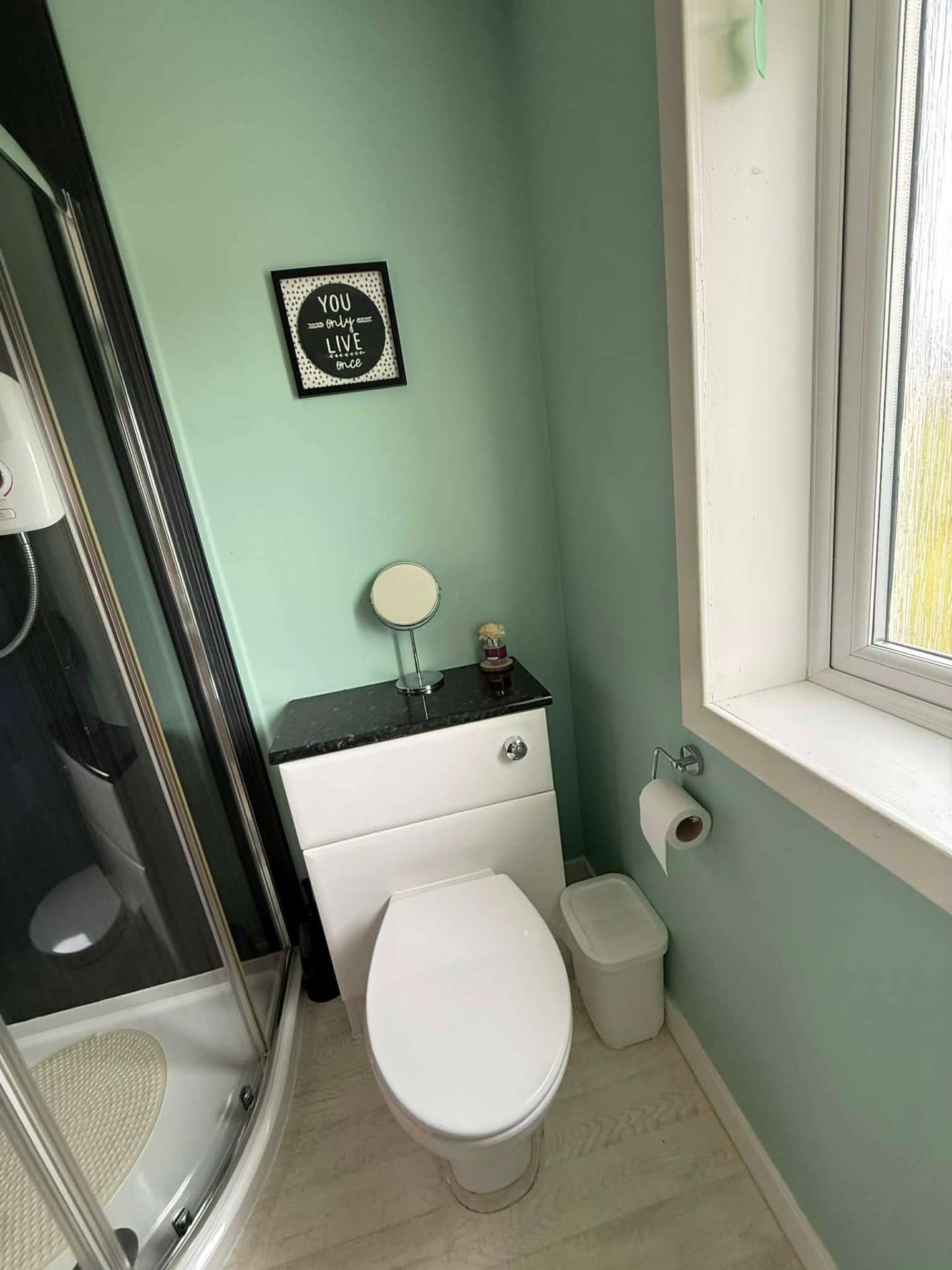 Bathroom with corner shower and WC
