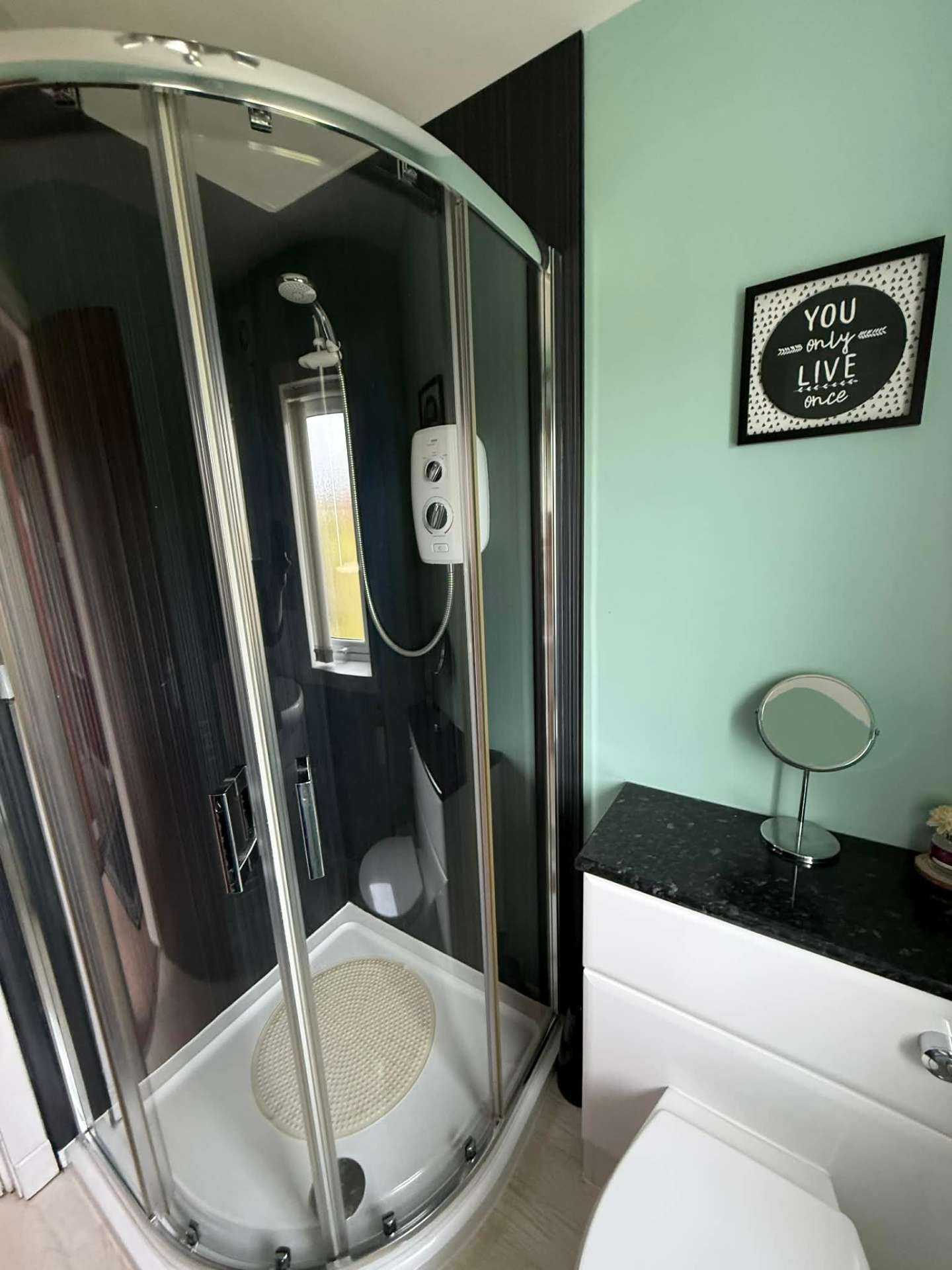 Corner shower enclosure